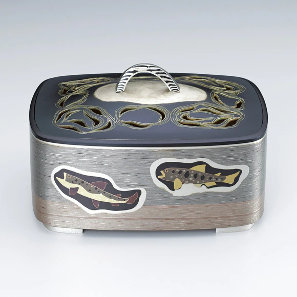 Incense burner of layered metals with design in inlay. “Thought on a mountain stream”