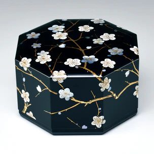 Octagonal box with plum blossom design in makie.