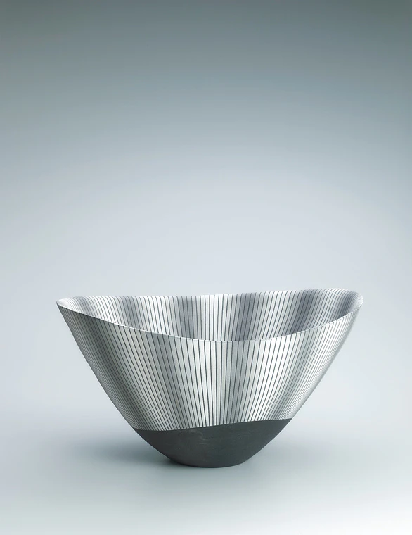 photo Large bowl with line design in colored slip.