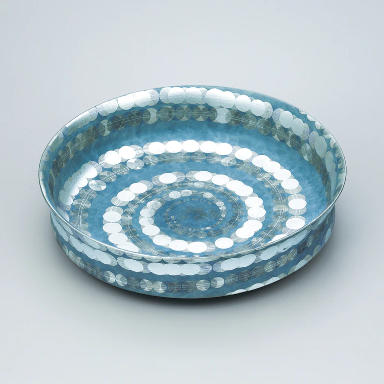 photo Flat bowl with spiral design in overglaze enamel and silver.