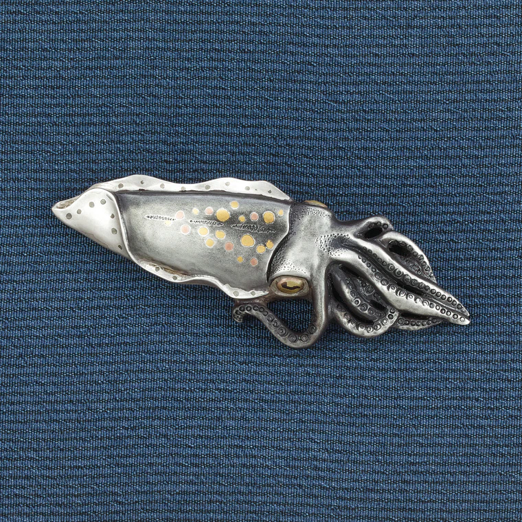 photo Metal fitting in shape of squid.