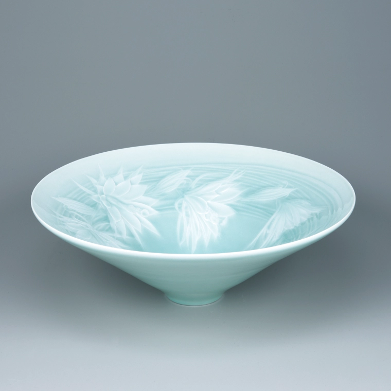 photo Bowl with Dutchman’s pipe cactus design in sunken relief.