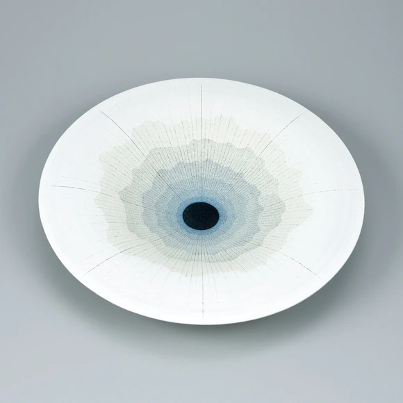 Bowl with flower design in colored slip.