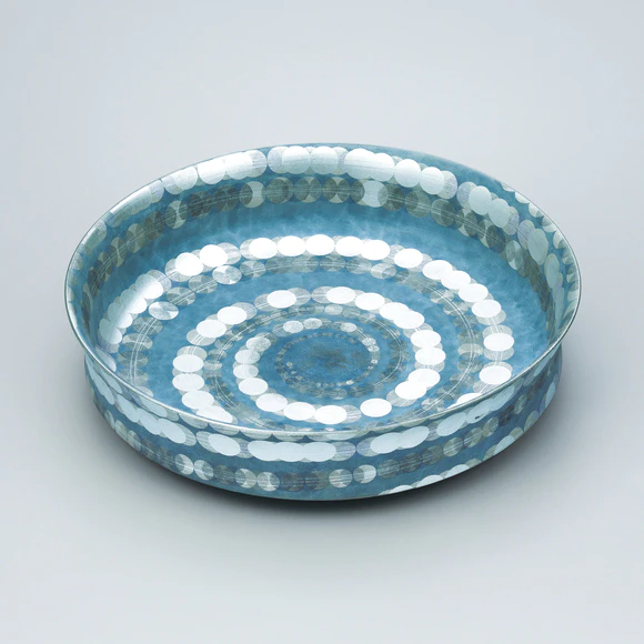 Flat bowl with spiral design in overglaze enamel and silver.