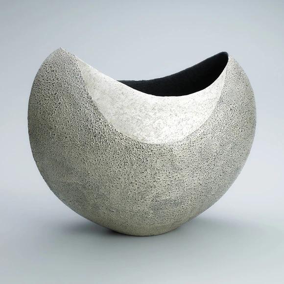 Flower vessel with silver bubble-like decoration.