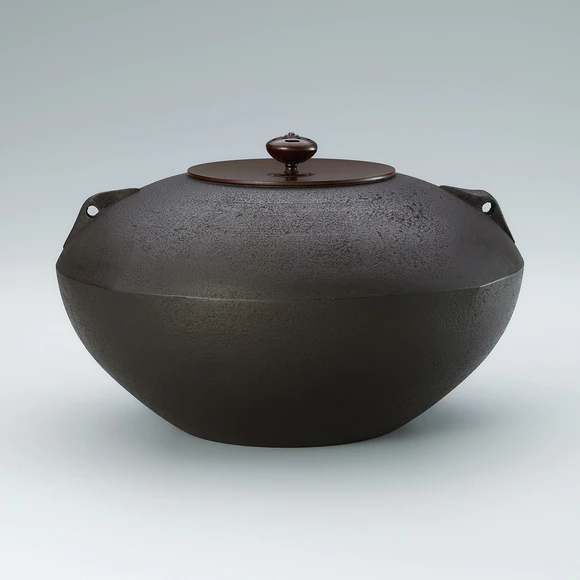 Tea ceremony kettle in shape of square top.