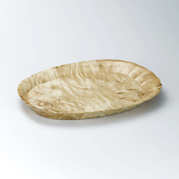 Shell-shaped tray of horse chestnut wood made in scooping out method.
