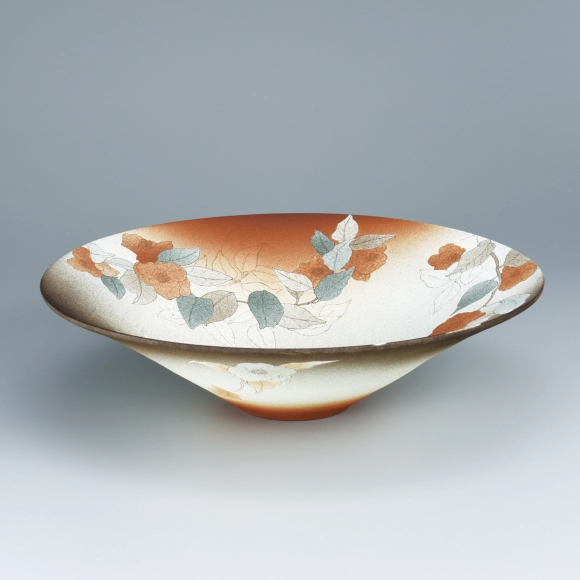 Bowl with colored flower design in sgraffito.