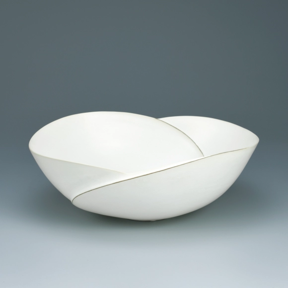 Bowl with white glaze and ridge line design.