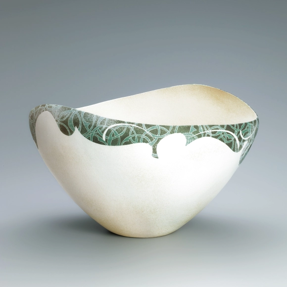 Bowl with lotus and circle design in colored slip.