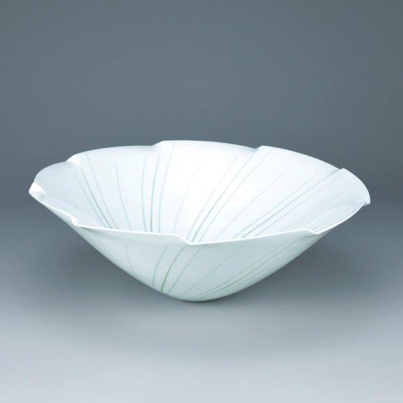 Bowl with engraved design and glaze inlay.