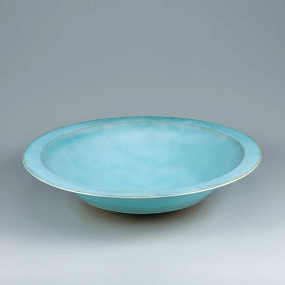 Bowl with pale blue glaze.