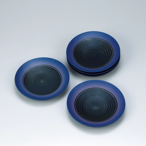 Set of dishes with colored glaze and chattered design.