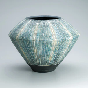 Flower vessel with colored slip inlay decoration.