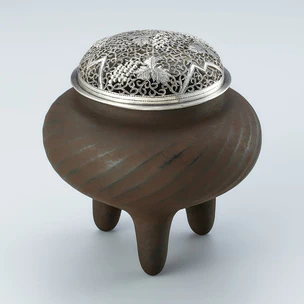 Iron tripod incense burner made in hammer work.