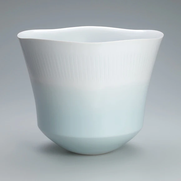 Large flower vessel with celadon glaze and blurred white decoration. “Shower”