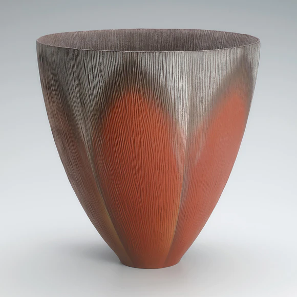 Vessel shaped by beating with colored slip painting.