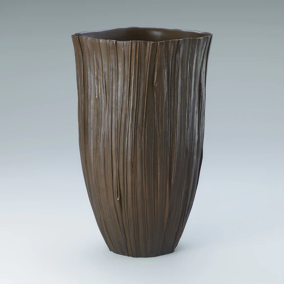 Copper flower vessel cast in lost wax casting method.