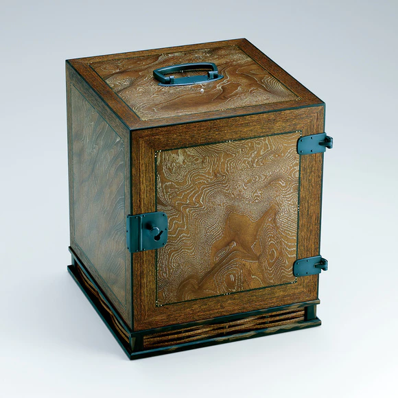 Small chest of drawers made of zelkova wood finished in wiped urushi.