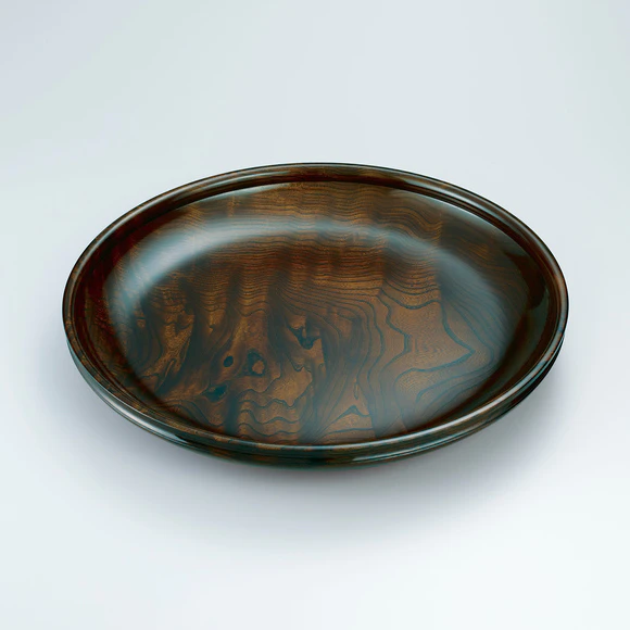 Plate of zelkova wood finished in wiped urushi.
