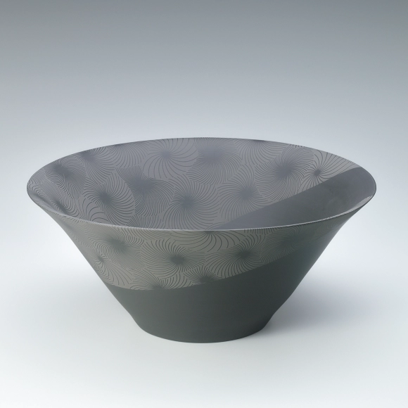 Banko black bowl with line engraved design.