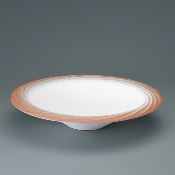 Bowl with colored slip and engraved decoration.