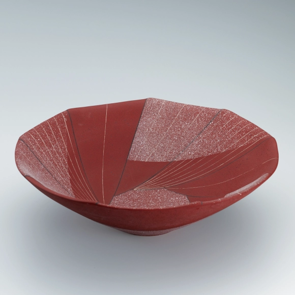 Bowl with sprayed slip and line design in sgraffito.