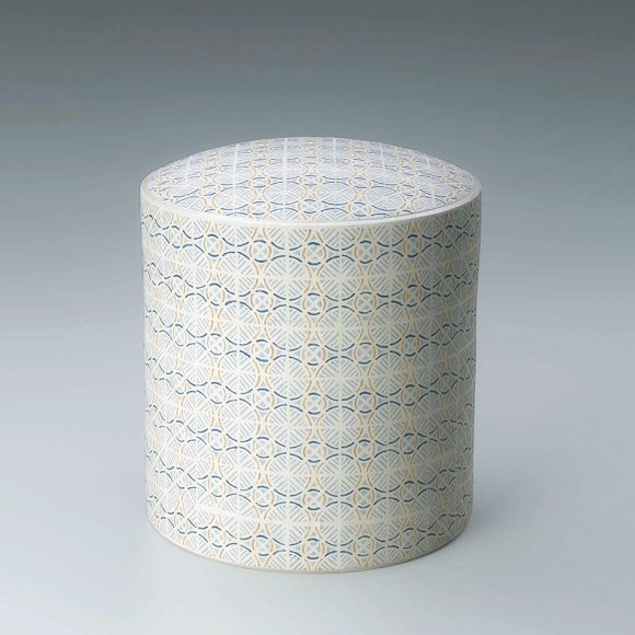 Box with wavy line design in joined cut paper stencil.