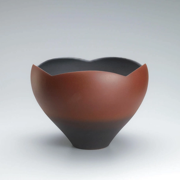 Flower vessel with red glaze.