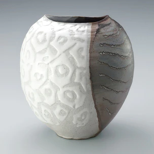 Jar in irregular shape with iron and white glazes in kakewake style and hexagon design.