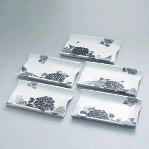 Set of dishes with hydrangea design in underglaze blue and overglaze frit pigments.