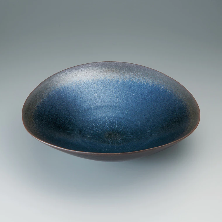 photo Bowl with kiln mutation of bright streaming color.