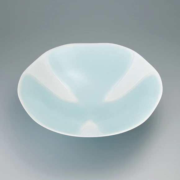 Large bowl with celadon glaze and blurred white decoration. “Waterfall”
