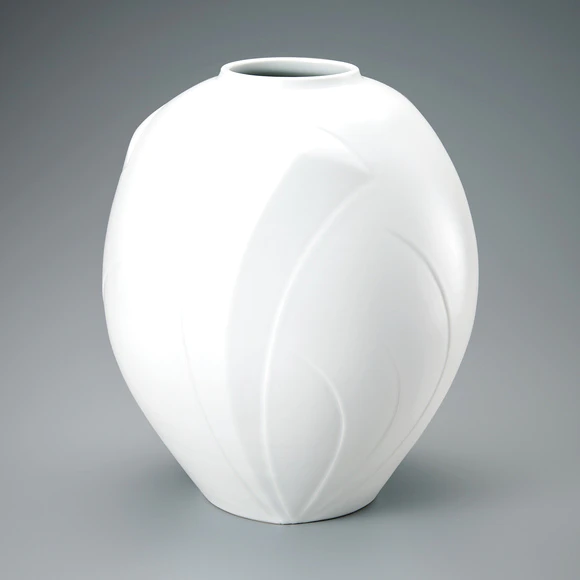 White porcelain jar with engraved design.