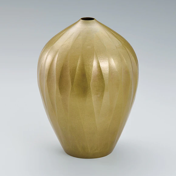 Hammer worked brass jar.