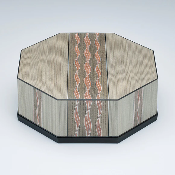Octagonal box of jindai cedar wood with wave design.