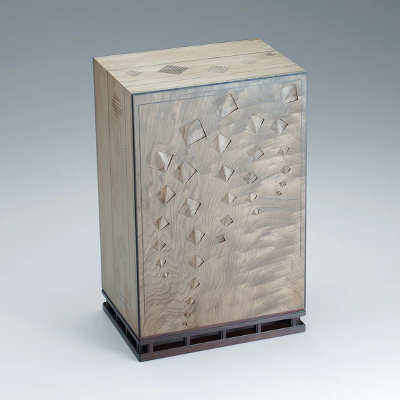 Box of jindai cedar wood with carved design.
