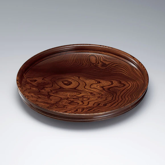 Plate of zelkova wood finished in wiped urushi.