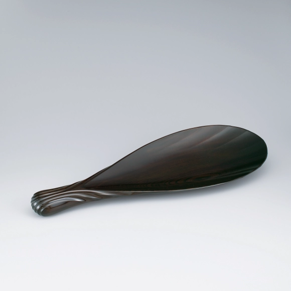 Petal-shaped plate of jindai zelkova wood finished in wiped urushi.