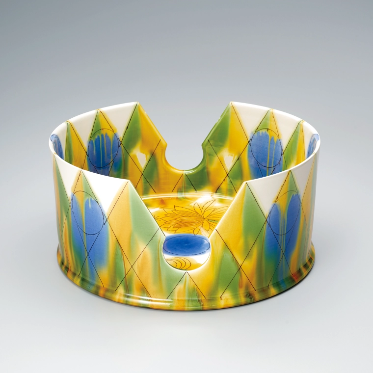 photo Vessel with large gaps in the wall and Dutchman's pipe cactus design in running colored overglaze enamel decoration.