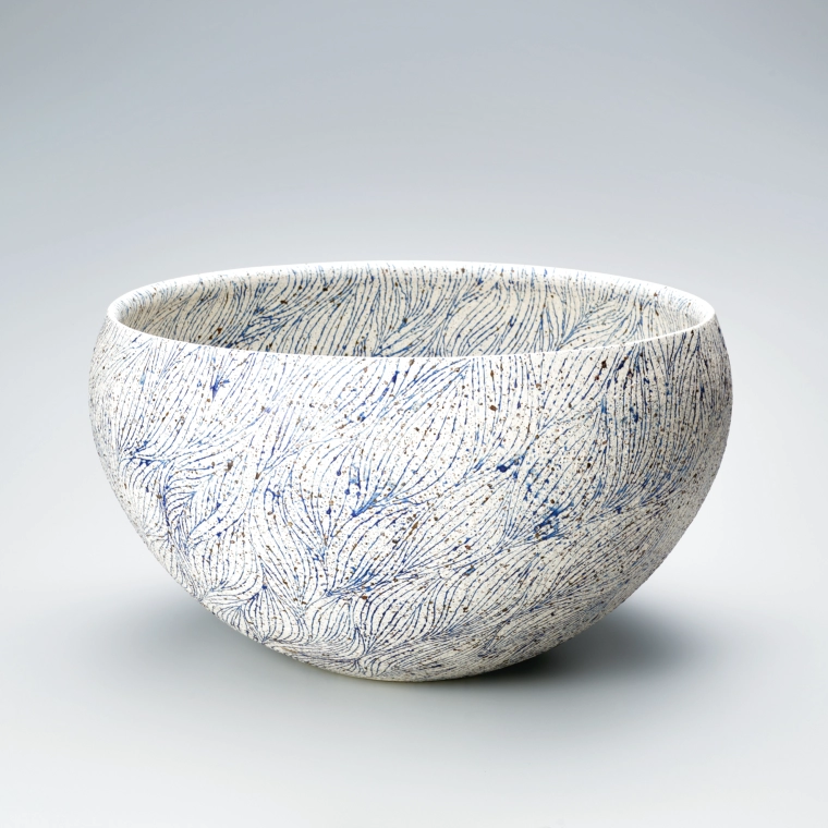 photo Large bowl with line design in color glaze.