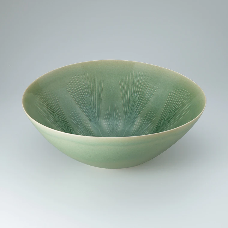 photo Bowl with green celadon glaze and wheat design.