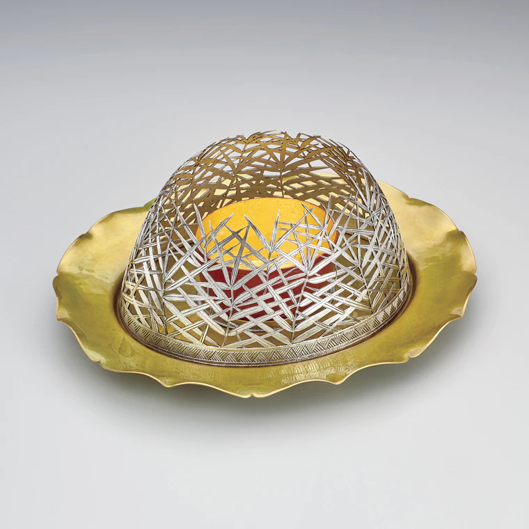 photo Brass incense burner with silver openwork design.