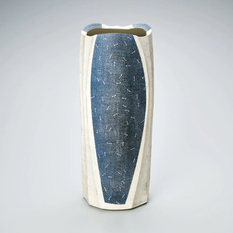photo Flower vessel with grass design in colored slip.