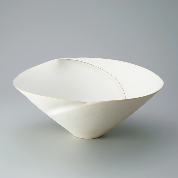 Bowl with white glaze and ridge line design.