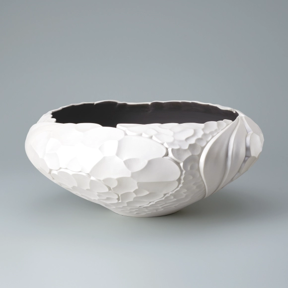 Flower vessel with silky white surface.