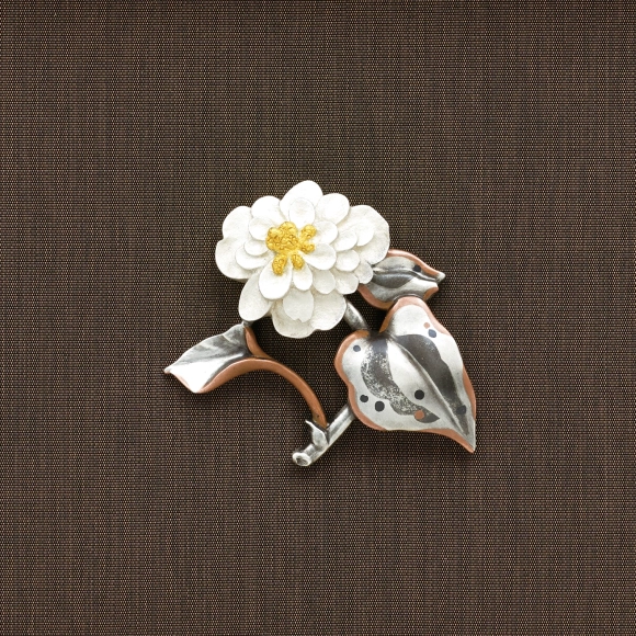 Brooch. “Dokudami plant”