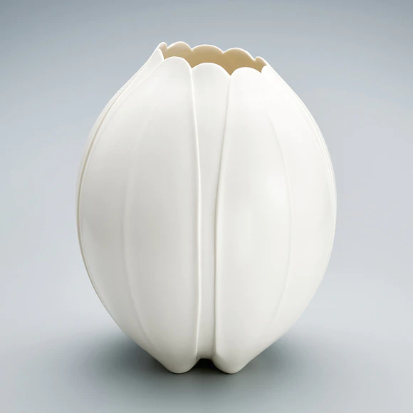 Jar with ivory white glaze and carved decoration.