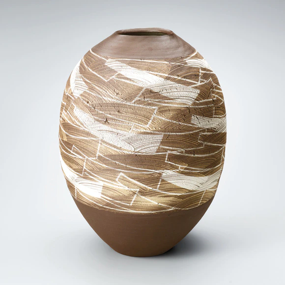 Jar with brush mark design in iron brown.