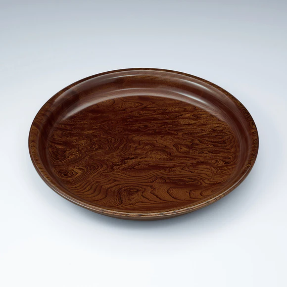 Plate of zelkova wood finished in wiped urushi.